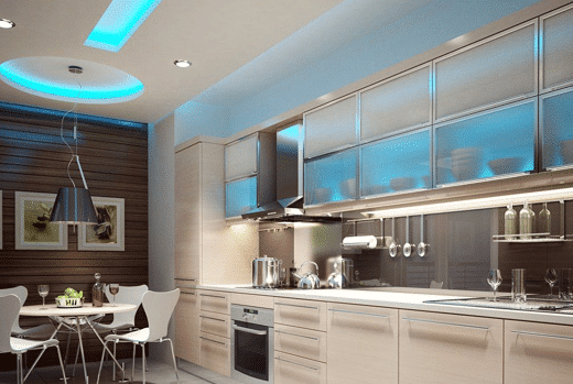 A modern kitchen with blue lighting.